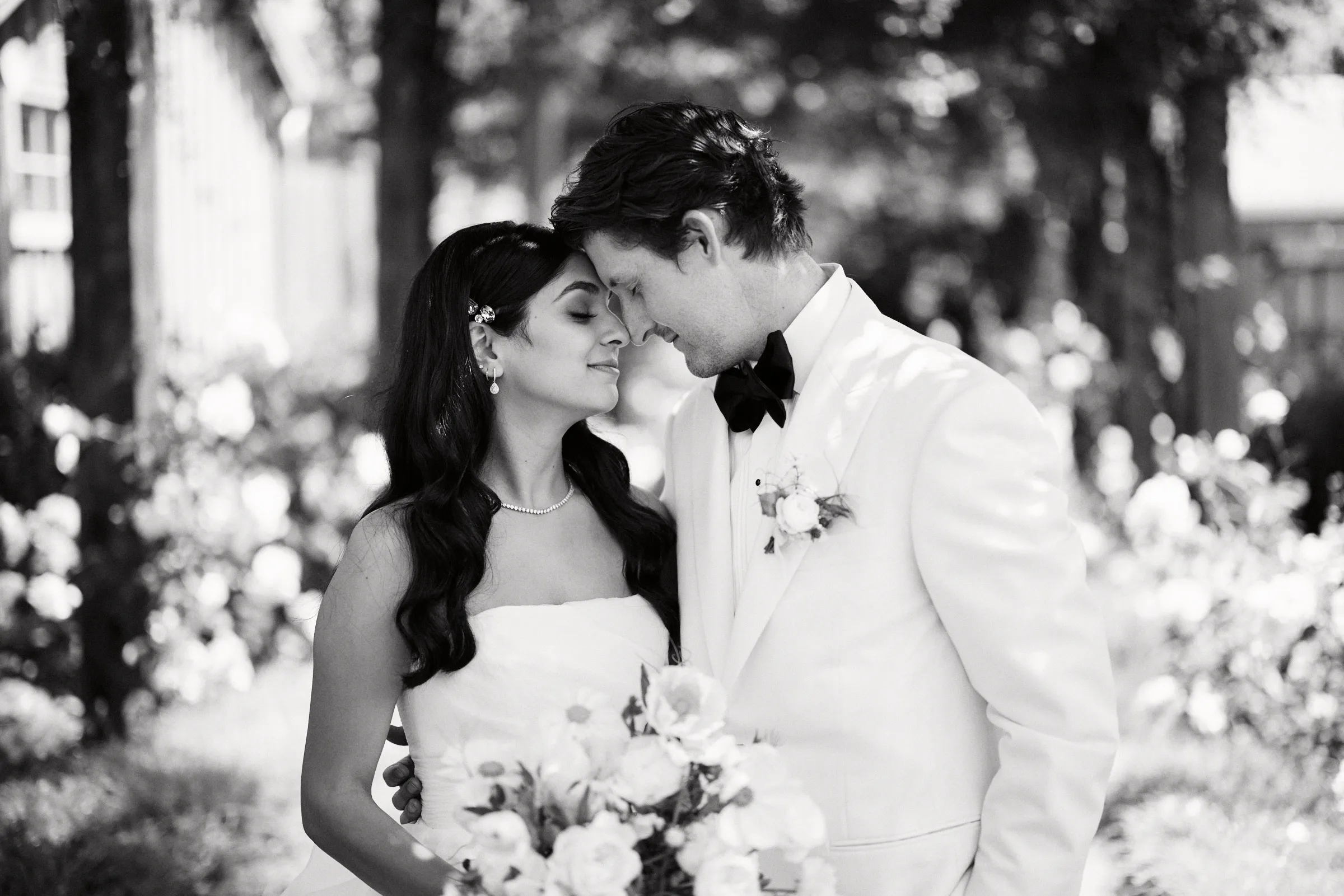 The couple forehead to forehead, in black and white