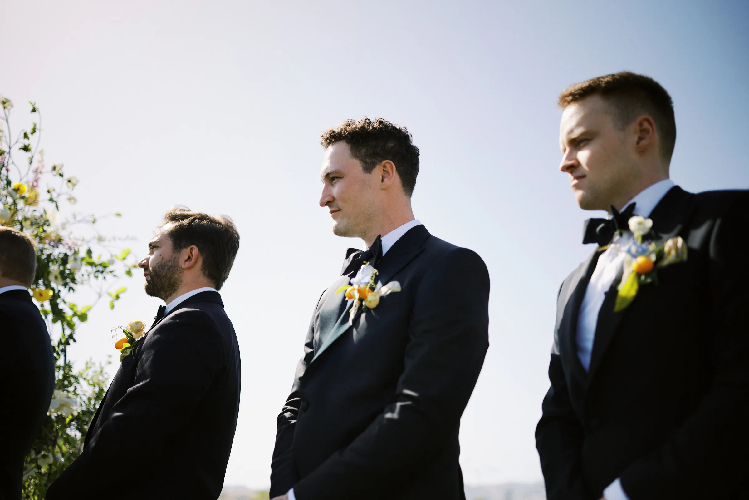 The groomsmen watching the ceremony